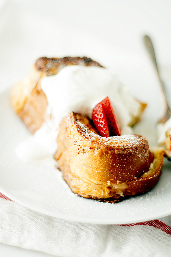 perfect for Easter or Mother's Day Brunch! Stuffed french toast, topped with whipped cream and strawberries, this strawberry shortcake french toast is a breakfast lovers dream.