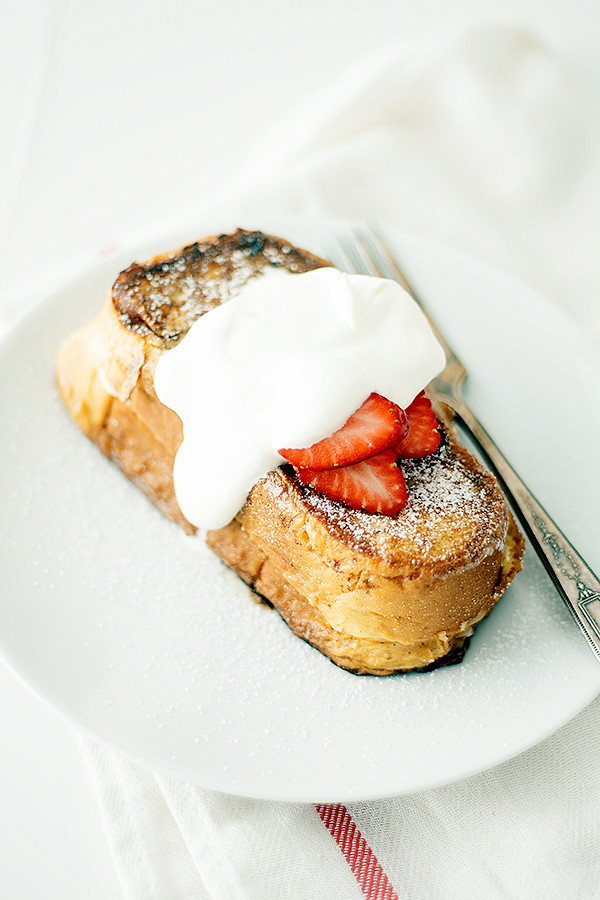 perfect for Easter or Mother's Day Brunch! Stuffed french toast, topped with whipped cream and strawberries, this strawberry shortcake french toast is a breakfast lovers dream.