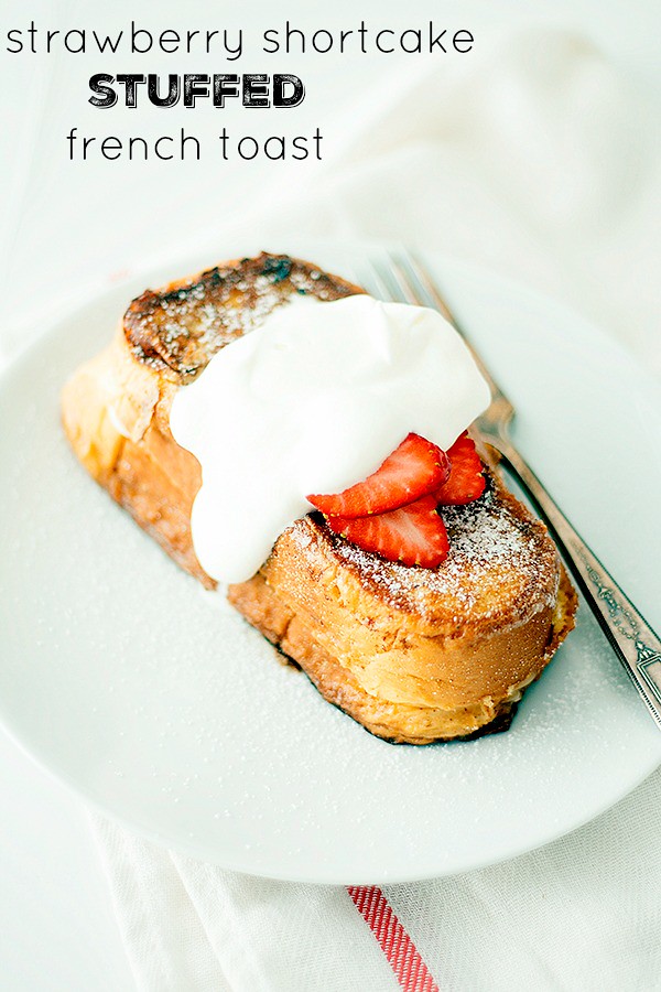 perfect for Easter or Mother's Day Brunch! Stuffed french toast, topped with whipped cream and strawberries, this strawberry shortcake french toast is a breakfast lovers dream.