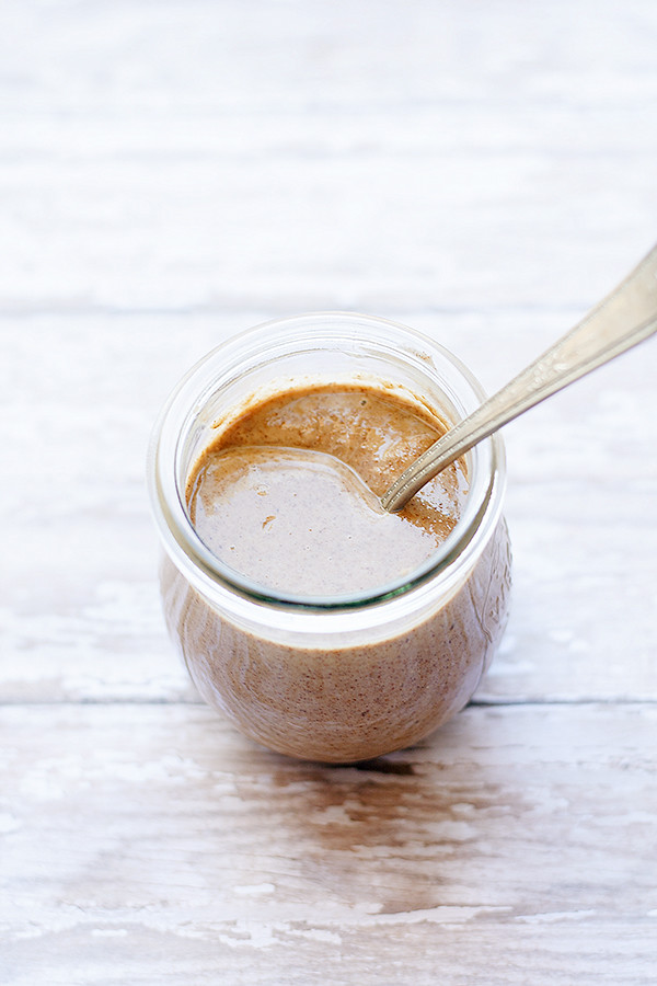 snickerdoodle almond butter in jar with spoon