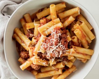 the ery best in comfort food | a big bowl of pasta topped with grandma's spaghetti sauce